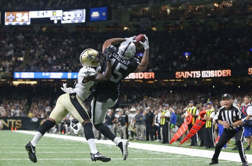 Sep 11, 2016; New Orleans, LA, USA; Oakland Raiders wide receiver Michael Crabtree (15) makes a catch for a two-point conversion while defended by New Orleans Saints cornerback Ken Crawley (46) late in the fourth quarter at the Mercedes-Benz Superdome. The Raiders won 35-34. Mandatory Credit: Chuck Cook-USA TODAY Sports