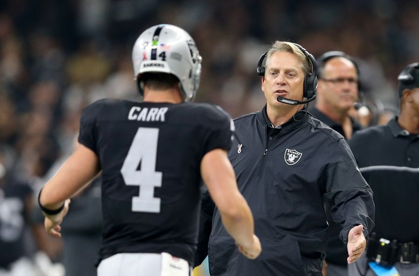 Sep 11, 2016; New Orleans, LA, USA; Oakland Raiders head coach Jack Del Rio talks to quarterback Derek Carr (4) in the second quarter of their game against the New Orleans Saints at the Mercedes-Benz Superdome. Mandatory Credit: Chuck Cook-USA TODAY Sports