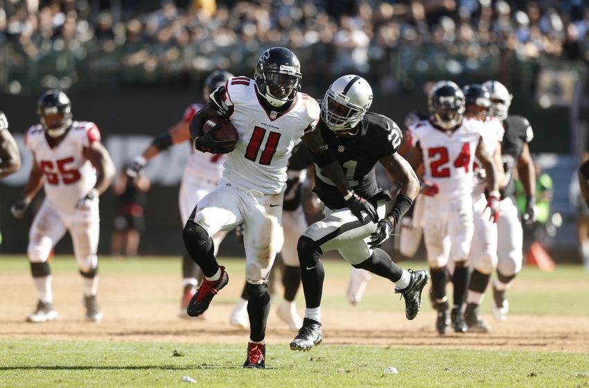 Sep 18, 2016; Oakland, CA, USA; Atlanta Falcons wide receiver Julio Jones (11) runs with the ball after making a catch against the Oakland Raiders in the fourth quarter at Oakland-Alameda County Coliseum. The Falcons defeated the Raiders 35-28. Mandatory Credit: Cary Edmondson-USA TODAY Sports