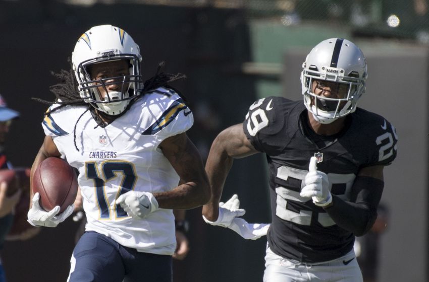 October 9, 2016; Oakland, CA, USA; San Diego Chargers wide receiver Travis Benjamin (12) runs past Oakland Raiders cornerback David Amerson (29) during the second quarter at Oakland Coliseum. Mandatory Credit: Kyle Terada-USA TODAY Sports
