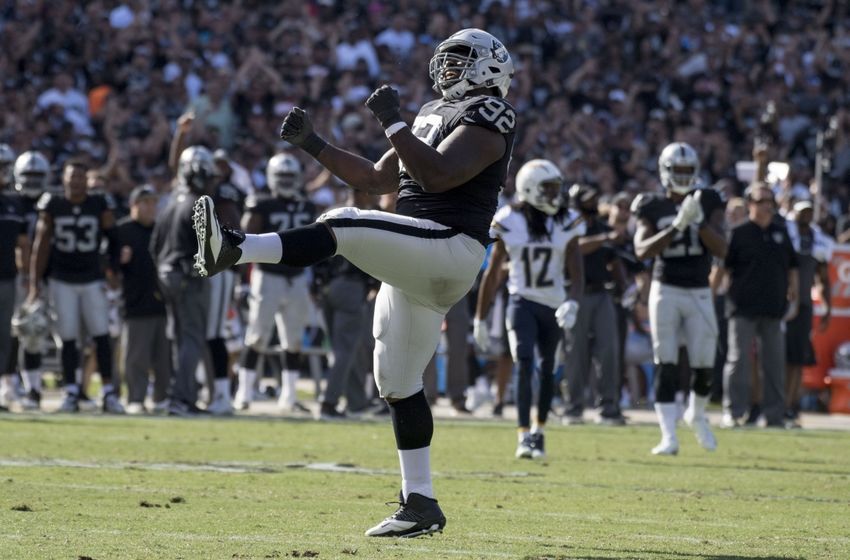 October 9, 2016; Oakland, CA, USA; Oakland Raiders defensive tackle Stacy McGee (92) celebrates after a defensive stop against the San Diego Chargers during the third quarter at Oakland Coliseum. Mandatory Credit: Kyle Terada-USA TODAY Sports