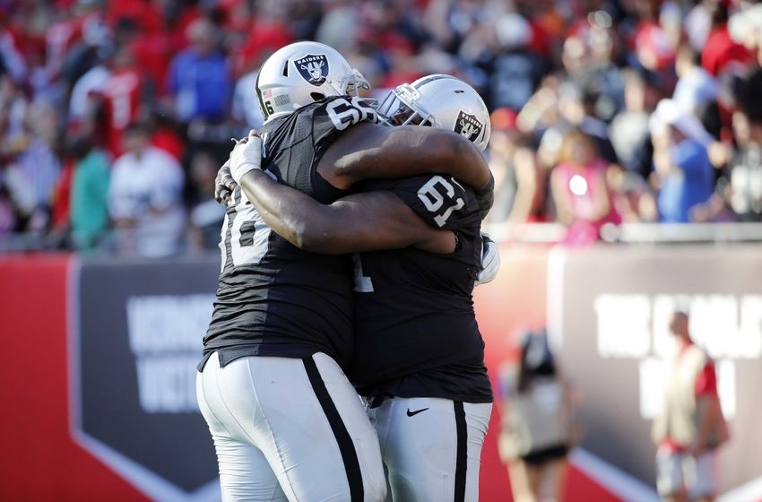 Oct 30, 2016; Tampa, FL, USA; Oakland Raiders guard Gabe Jackson (66) and center Rodney Hudson (61) hug after they beat the Tampa Bay Buccaneers in overtime during the second half at Raymond James Stadium. Oakland Raiders defeated the Tampa Bay Buccaneers 30-24 in overtime. Mandatory Credit: Kim Klement-USA TODAY Sports