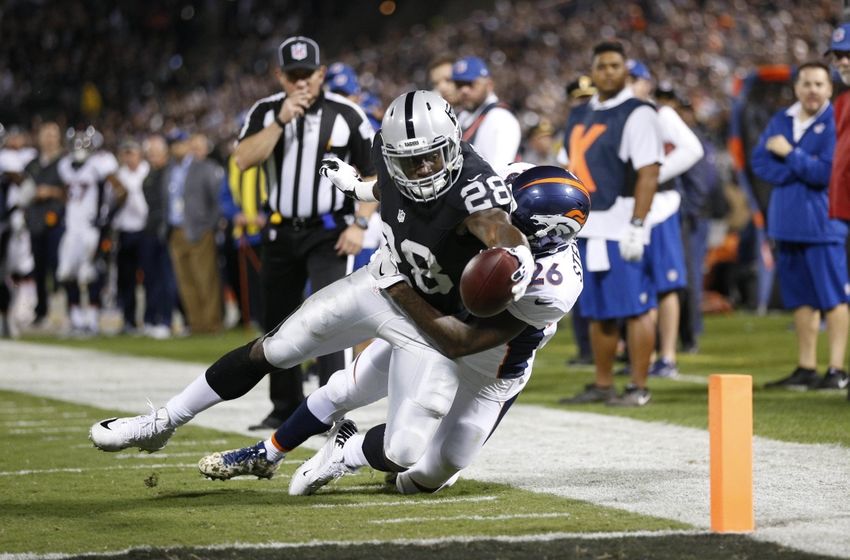 Nov 6, 2016; Oakland, CA, USA; Oakland Raiders running back Latavius Murray (28) is stopped short of the end zone by Denver Broncos safety Darian Stewart (26) in the second quarter at Oakland Coliseum. Mandatory Credit: Cary Edmondson-USA TODAY Sports