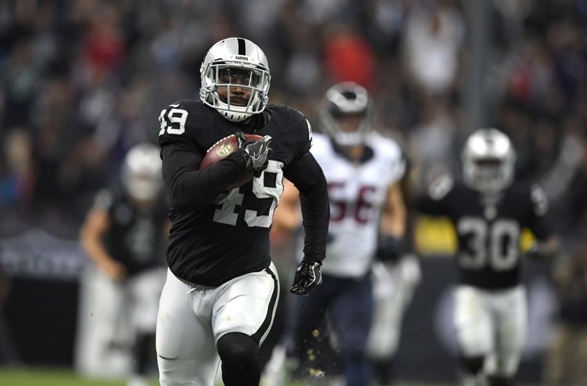 Nov 21, 2016; Mexico City, MEX; Oakland Raiders fullback Jamize Olawale (49) scores on a 75-yard touchdown reception in the fourth quarter against the Houston Texans during a NFL International Series game at Estadio Azteca. The Raiders defeated the Texans 27-20. Mandatory Credit: Kirby Lee-USA TODAY Sports