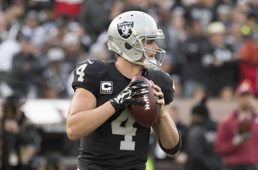November 27, 2016; Oakland, CA, USA; Oakland Raiders quarterback Derek Carr (4) looks for a receiver against the Carolina Panthers during the third quarter at Oakland Coliseum. The Raiders defeated the Panthers 35-32. Mandatory Credit: Kyle Terada-USA TODAY Sports