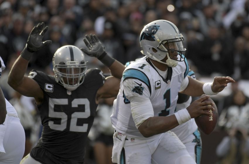 Nov 27, 2016; Oakland, CA, USA; Carolina Panthers quarterback Cam Newton (1) is pressured by Oakland Raiders defensive end Khalil Mack (52) during a NFL football game at Oakland-Alameda County Coliseum. Mandatory Credit: Kirby Lee-USA TODAY Sports