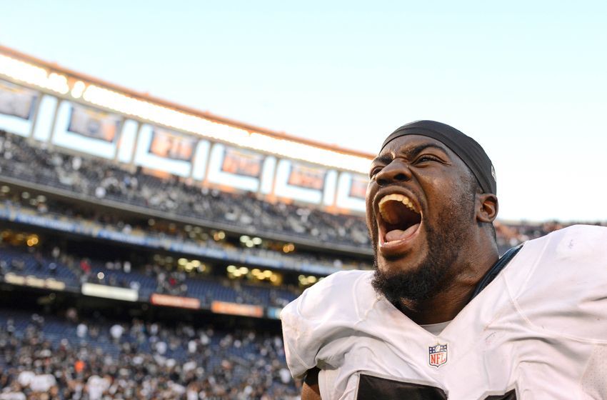 Dec 18, 2016; San Diego, CA, USA; Oakland Raiders tackle Menelik Watson (71) celebrates as he runs off the field after a 19-16 win over the San Diego Chargers at Qualcomm Stadium. Mandatory Credit: Jake Roth-USA TODAY Sports