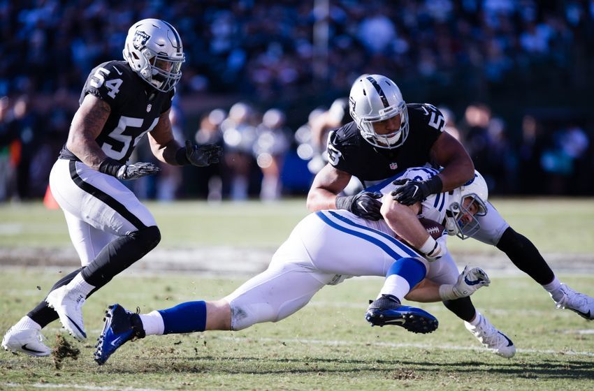 Dec 24, 2016; Oakland, CA, USA; Indianapolis Colts tight end Jack Doyle (84) is stopped by Oakland Raiders outside linebacker Malcolm Smith (53) during the second quarter at the Oakland Coliseum. Mandatory Credit: Kelley L Cox-USA TODAY Sports