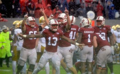 N.C. State celebrates a huge stop vs Notre Dame