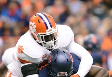 Clemson vs Syracuse: Nov 14, 2015; Syracuse, NY, USA; Clemson Tigers defensive end Shaq Lawson (90) makes a tackle on Syracuse Orange running back Jordan Fredericks (22) during the first quarter of a game at the Carrier Dome. Mandatory Credit: Mark Konezny-USA TODAY Sports