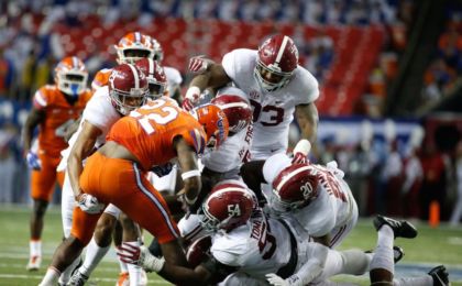 Dec 3, 2016; Atlanta, GA, USA; Florida Gators running back Lamical Perine (22) is brought down by the Alabama Crimson Tide defense during the second quarter of the SEC Championship college football game at Georgia Dome. Alabama defeated Florida 54-16. Mandatory Credit: Jason Getz-USA TODAY Sports