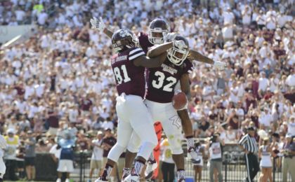 Sep 19, 2015; Starkville, MS, USA; Mississippi State Bulldogs wide receiver Justin Johnson (81) and wide receiver Donald Gray (6) and running back Ashton Shumpert (32) celebrate after a touchdown by Shumpert during the first quarter of the game against the Northwestern State Demons at Davis Wade Stadium. Mandatory Credit: Matt Bush-USA TODAY Sports