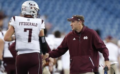 Sep 24, 2016; Foxborough, MA, USA; Mississippi State Bulldogs head coach Dan Mullen congratulates quarterback Nick Fitzgerald (7) after a touchdown during the third quarter against the Massachusetts Minutemen at Gillette Stadium. Mississippi State won 47-35. Credit: Greg M. Cooper-USA TODAY Sports