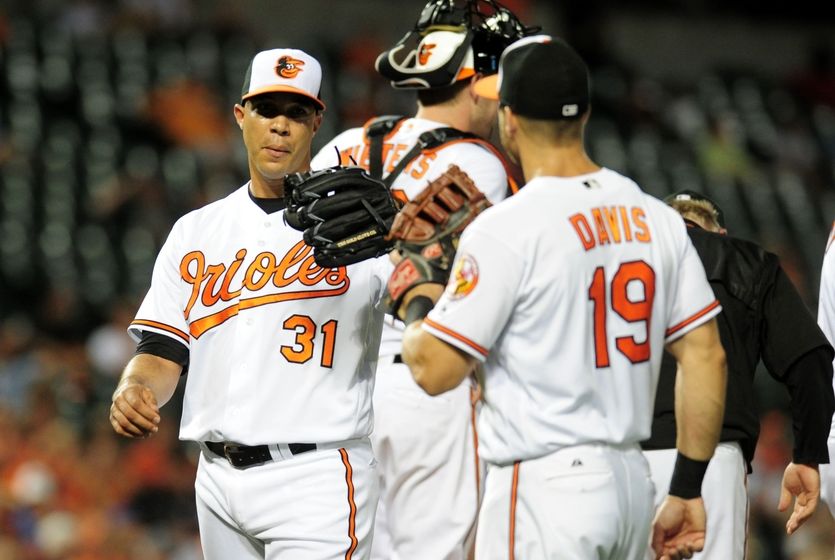 Aug 30, 2016; Baltimore, MD, USA; Baltimore Orioles pitcher Ubaldo Jimenez (31) is congratulated by first baseman Chris Davis (19) after being removed from the game in the seventh inning against the Toronto Blue Jays at Oriole Park at Camden Yards. Mandatory Credit: Evan Habeeb-USA TODAY Sports