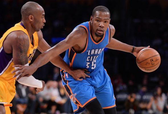 Dec 23, 2015; Los Angeles, CA, USA; Oklahoma City Thunder forward Kevin Durant (35) moves to the basket against Los Angeles Lakers forward Kobe Bryant (24) during the 2nd quarter at Staples Center. Mandatory Credit: Robert Hanashiro-USA TODAY Sports