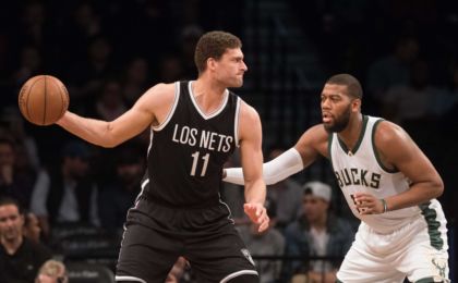 Mar 13, 2016; Brooklyn, NY, USA; Milwaukee Bucks center Greg Monroe (15) defends against Brooklyn Nets center Brook Lopez (11) in the first half at Barclays Center. Milwaukee defeats Brooklyn 109-100. Mandatory Credit: William Hauser-USA TODAY Sports