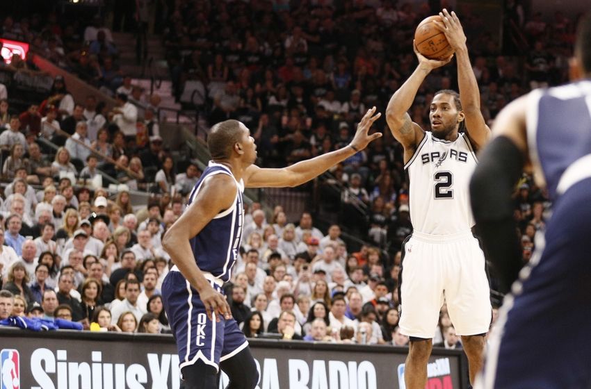 Apr 30, 2016; San Antonio, TX, USA; San Antonio Spurs small forward Kawhi Leonard (2) shoots the ball as Oklahoma City Thunder small forward Kevin Durant (35, left) defends in game one of the second round of the NBA Playoffs at AT&T Center. Mandatory Credit: Soobum Im-USA TODAY Sports