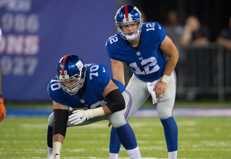 Aug 12, 2016; East Rutherford, NJ, USA;New York Giants quarterback Ryan Nassib (12) and New York Giants center Weston Richburg (70) in the first half at MetLife Stadium. Mandatory Credit: William Hauser-USA TODAY Sports