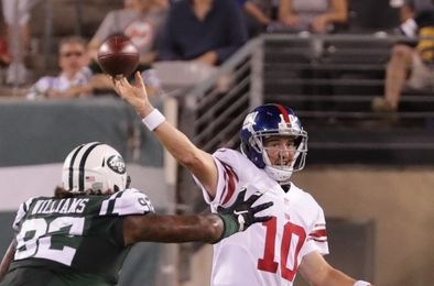 Aug 27, 2016; East Rutherford, NJ, USA; New York Giants quarterback Eli Manning (10) passes as New York Jets defensive tackle Leonard Williams (92) defends during the first half at MetLife Stadium. Mandatory Credit: Vincent Carchietta-USA TODAY Sports