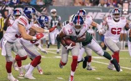 Aug 27, 2016; East Rutherford, NJ, USA; New York Giants defensive back Andrew Adams (33) returns an interception against the New York Jets during the second half at MetLife Stadium. The Giants won 21-20. Mandatory Credit: Vincent Carchietta-USA TODAY Sports