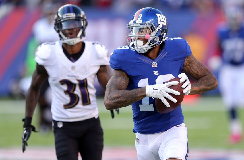 Oct 16, 2016; East Rutherford, NJ, USA; New York Giants wide receiver Odell Beckham Jr. (13) runs for a touchdown against Baltimore Ravens corner back Will Davis (31) during the fourth quarter at MetLife Stadium. Mandatory Credit: Brad Penner-USA TODAY Sports