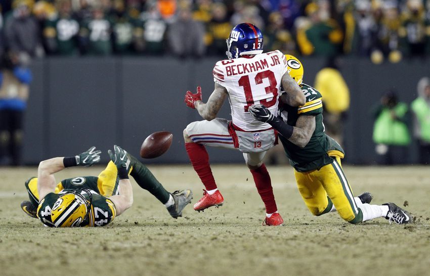 Jan 8, 2017; Green Bay, WI, USA; New York Giants wide receiver Odell Beckham (13) cannot catch a pass between Green Bay Packers inside linebacker Jake Ryan (47) and free safety Ha Ha Clinton-Dix (21) during the second half in the NFC Wild Card playoff football game at Lambeau Field. Mandatory Credit: Jeff Hanisch-USA TODAY Sports
