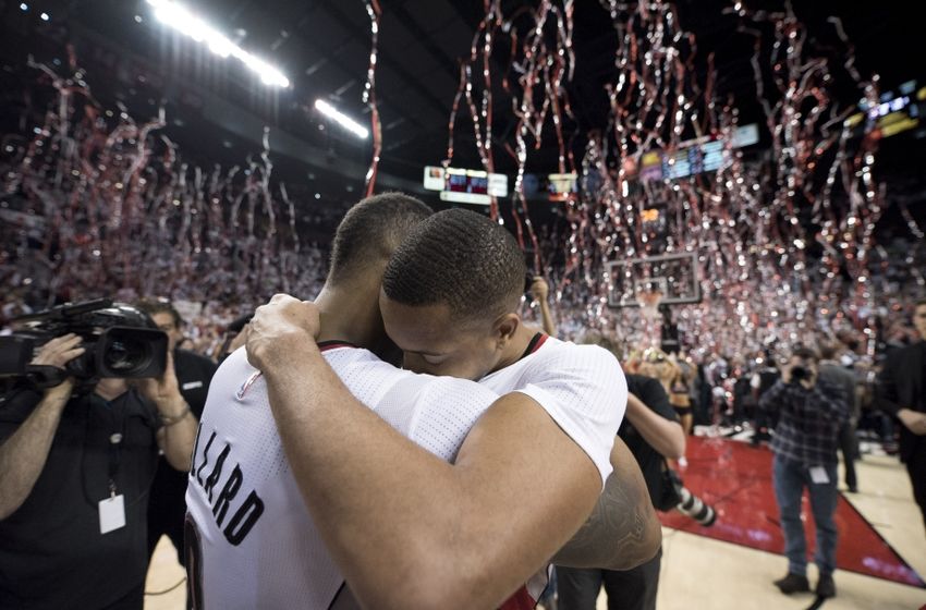 Apr 29, 2016; Portland, OR, USA; Portland Trail Blazers guard Damian Lillard (0) hugs guard CJ McCollum (3) after defeating the Los Angeles Clippers 106-103 in game six of the first round of the NBA Playoffs at Moda Center at the Rose Quarter. Mandatory Credit: Troy Wayrynen-USA TODAY Sports