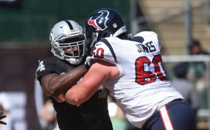 September 14, 2014; Oakland, CA, USA; Oakland Raiders defensive tackle Antonio Smith (94) against Houston Texans guard Ben Jones (60) during the second quarter at O.co Coliseum. The Texans defeated the Raiders 30-14. Mandatory Credit: Kyle Terada-USA TODAY Sports