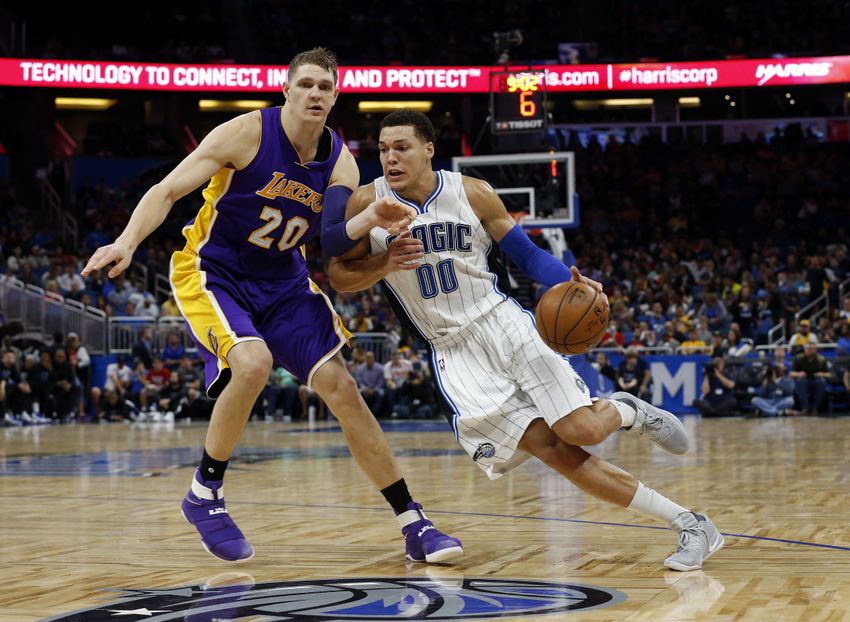 Dec 23, 2016; Orlando, FL, USA; Orlando Magic forward Aaron Gordon (00) drives to the basket as Los Angeles Lakers center Timofey Mozgov (20) defends during the second half at Amway Center.Orlando Magic defeated the Los Angeles Lakers 109-90. Mandatory Credit: Kim Klement-USA TODAY Sports