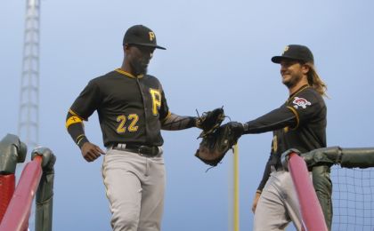 Apr 8, 2016; Cincinnati, OH, USA; Pittsburgh Pirates center fielder Andrew McCutchen (22) and first baseman John Jaso (28) walk back to the dugout during the second inning against the Cincinnati Reds at Great American Ball Park. Mandatory Credit: David Kohl-USA TODAY Sports