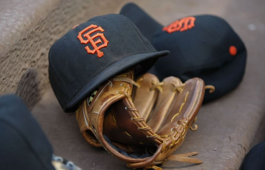 Aug 4, 2015; Atlanta, GA, USA; General view of a San Francisco Giants hat and glove in the dugout against the Atlanta Braves in the third inning at Turner Field. Mandatory Credit: Brett Davis-USA TODAY Sports