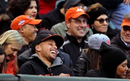 May 29, 2015; San Francisco, CA, USA; Golden State Warriors Stephen Curry is all smiles after the San Francisco Giants fans acknowledged Curry by chanting MVP at the end of the first inning between the Giants and the Atlanta Braves MLB baseball game at AT&T Park. Mandatory Credit: Lance Iversen-USA TODAY Sports. 