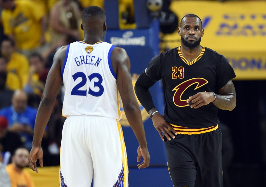 Jun 19, 2016; Oakland, CA, USA; Cleveland Cavaliers forward LeBron James (23) and Golden State Warriors forward Draymond Green (23) during the first quarter in game seven of the NBA Finals at Oracle Arena. Mandatory Credit: Bob Donnan-USA TODAY Sports