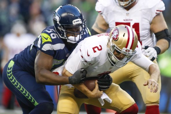 Nov 22, 2015; Seattle, WA, USA; Seattle Seahawks defensive end Cliff Avril (56) sacks San Francisco 49ers quarterback Blaine Gabbert (2) during the fourth quarter at CenturyLink Field. Seattle defeated San Francisco, 29-13. Mandatory Credit: Joe Nicholson-USA TODAY Sports