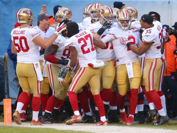 Dec 6, 2015; Chicago, IL, USA; San Francisco 49ers wide receiver Torrey Smith (82) celebrates with teammates after scoring the game winning 71 yard touchdown during the overtime against the Chicago Bears at Soldier Field. The 49ers won 26-20 in overtime. Mandatory Credit: Dennis Wierzbicki-USA TODAY Sports