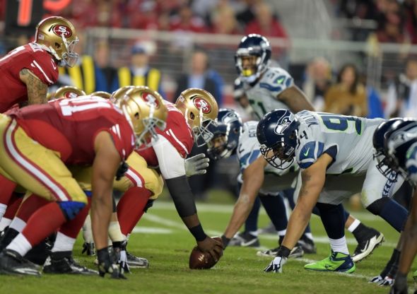 Nov 27, 2014; Santa Clara, CA, USA; General view of the line of scrimmage as San Francisco 49ers center Marcus Martin (66) snaps the ball to quarterback Colin Kaepernick (7) against the Seattle Seahawks at Levi's Stadium. The Seahawks defeated the 49ers 19-3 in the Thanksgiving Day game.Mandatory Credit: Kirby Lee-USA TODAY Sports