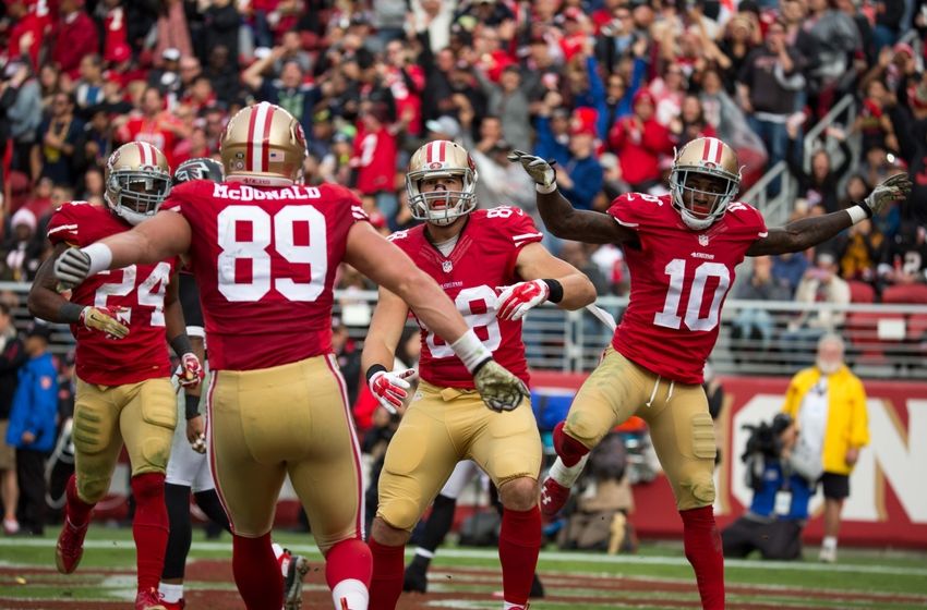 November 8, 2015; Santa Clara, CA, USA; San Francisco 49ers tight end Garrett Celek (88) is congratulated by tight end Vance McDonald (89) and wide receiver Bruce Ellington (10) for scoring a touchdown during the second quarter against the Atlanta Falcons at Levi Stadium. Mandatory Credit: USA Today Sports