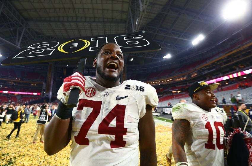 Jan 11, 2016; Glendale, AZ, USA; Alabama Crimson Tide offensive lineman Cam Robinson (74) and linebacker Reuben Foster (10) celebrate after defeating the Clemson Tigers in the 2016 CFP National Championship at University of Phoenix Stadium. Mandatory Credit: Mark J. Rebilas-USA TODAY Sports