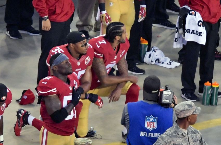 Sep 12, 2016; Santa Clara, CA, USA; San Francisco 49ers quarterback Colin Kapernick and teammate 49ers free safety Eric Reid (35) kneel during the playing of the national anthem before a NFL game against the Los Angeles Rams at Levi's Stadium. Mandatory Credit: Kirby Lee-USA TODAY Sports