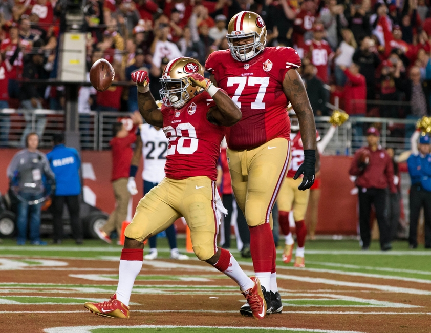 Sep 12, 2016; Santa Clara, CA, USA; San Francisco 49ers running back Carlos Hyde (28) celebrates after he scores a touchdown against the Los Angeles Rams in the fourth quarter at Levi's Stadium. The 49ers won 28-0. Mandatory Credit: John Hefti-USA TODAY Sports