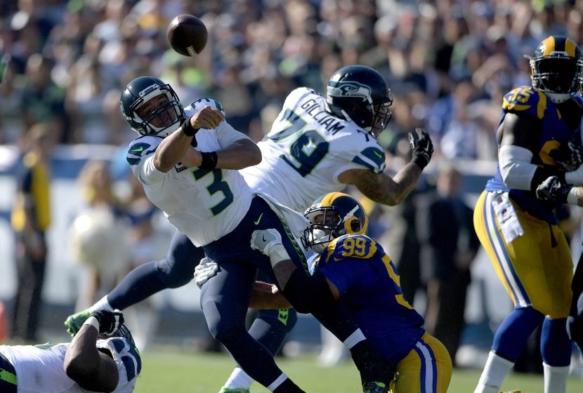 Sep 18, 2016; Los Angeles, CA, USA; Seattle Seahawks quarterback Russell Wilson (3) is pressured by Los Angeles Rams defensive tackle Aaron Donald (99) during a NFL game at Los Angeles Memorial Coliseum. Mandatory Credit: Kirby Lee-USA TODAY Sports