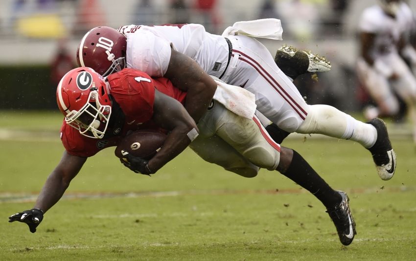 Oct 3, 2015; Athens, GA, USA; Georgia Bulldogs running back Sony Michel (1) is tackled by Alabama Crimson Tide linebacker Reuben Foster (10) during the second quarter at Sanford Stadium. Mandatory Credit: Dale Zanine-USA TODAY Sports