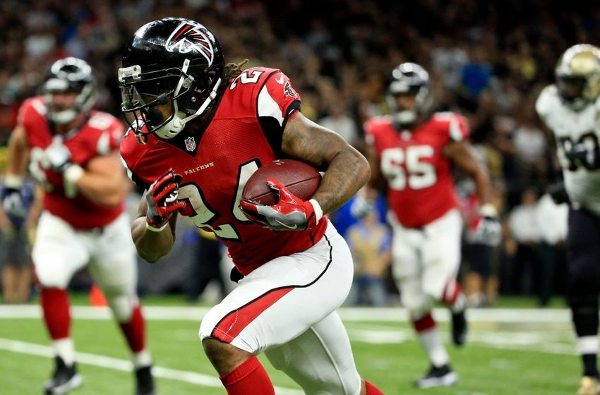 Sep 26, 2016; New Orleans, LA, USA; Atlanta Falcons running back Devonta Freeman (24) carries the ball to score a touchdown during the second quarter of a game against the New Orleans Saints at the Mercedes-Benz Superdome. Mandatory Credit: Derick E. Hingle-USA TODAY Sports