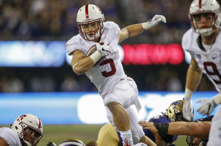 Sep 30, 2016; Seattle, WA, USA; Stanford Cardinal running back Christian McCaffrey (5) rushes the ball against the Washington Huskies during the second half at Husky Stadium. Washington won 44-6. Mandatory Credit: Jennifer Buchanan-USA TODAY Sports