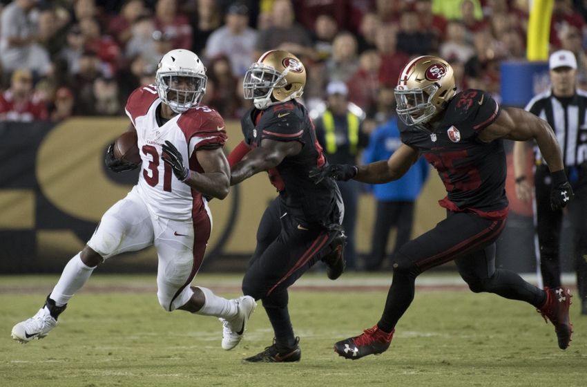 October 6, 2016; Santa Clara, CA, USA; Arizona Cardinals running back David Johnson (31) runs against San Francisco 49ers strong safety Jaquiski Tartt (29) and free safety Eric Reid (35) during the third quarter at Levi's Stadium. The Cardinals defeated the 49ers 33-21. Mandatory Credit: Kyle Terada-USA TODAY Sports