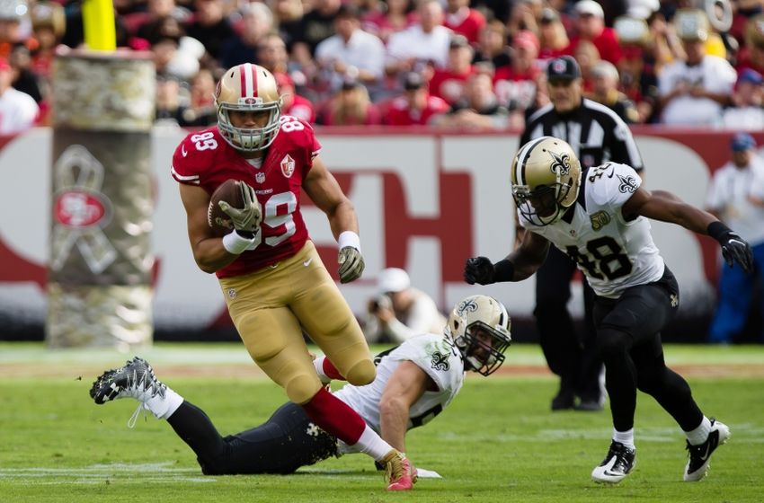 Nov 6, 2016; Santa Clara, CA, USA; San Francisco 49ers tight end Vance McDonald (89) carries the ball past New Orleans Saints inside linebacker Nate Stupar (54) and free safety Vonn Bell (48) during the first quarter at Levi's Stadium. Mandatory Credit: Kelley L Cox-USA TODAY Sports