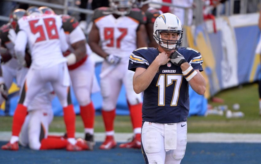 Dec 4, 2016; San Diego, CA, USA; San Diego Chargers quarterback Philip Rivers (17) reacts after throwing an interception that was returned for a touchdown by Tampa Bay Buccaneers outside linebacker Lavonte David (kneeling) during the second half at Qualcomm Stadium. Tampa Bay won 28-21. Mandatory Credit: Orlando Ramirez-USA TODAY Sports