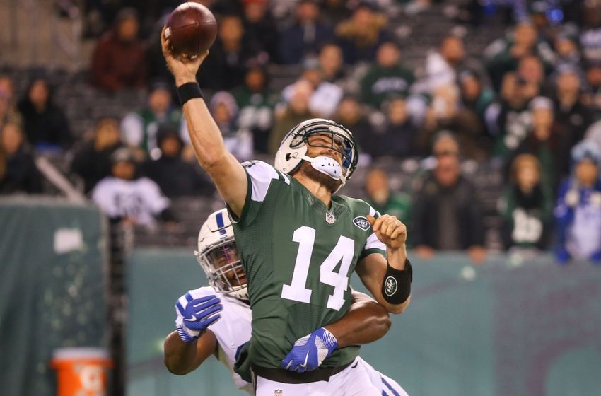 Dec 5, 2016; East Rutherford, NJ, USA; New York Jets quarterback Ryan Fitzpatrick (14) is hit by Indianapolis Colts defensive tackle Hassan Ridgeway (91) as he throws a pass during the first half at MetLife Stadium. Mandatory Credit: Ed Mulholland-USA TODAY Sports