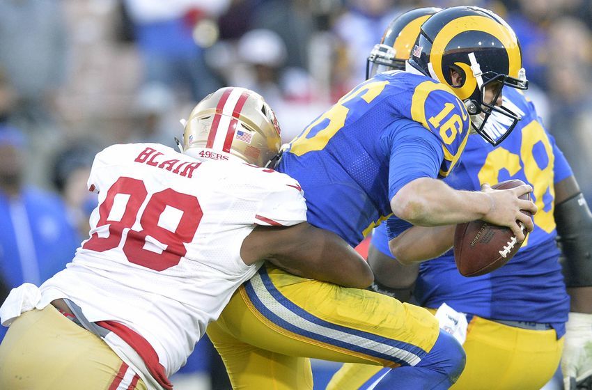 December 24, 2016; Los Angeles, CA, USA; Los Angeles Rams quarterback Jared Goff (16) is brought down by San Francisco 49ers defensive end Ronald Blair (98) during the second half at Los Angeles Memorial Coliseum. Mandatory Credit: Gary A. Vasquez-USA TODAY Sports