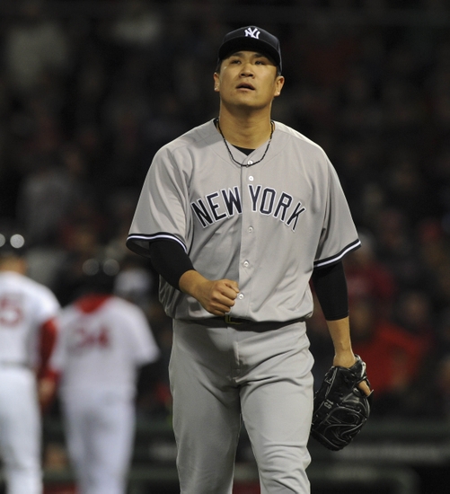 Apr 29, 2016; Boston, MA, USA; New York Yankees starting pitcher Masahiro Tanaka (19) walks off the mound after pitching during the sixth inning against the Boston Red Sox at Fenway Park. Mandatory Credit: Bob DeChiara-USA TODAY Sports